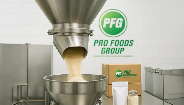 Industrial dry blending machine at Pro Foods Group facility with powder mixing inside stainless steel equipment, representing custom formulations, consistency, and turnkey production solutions.